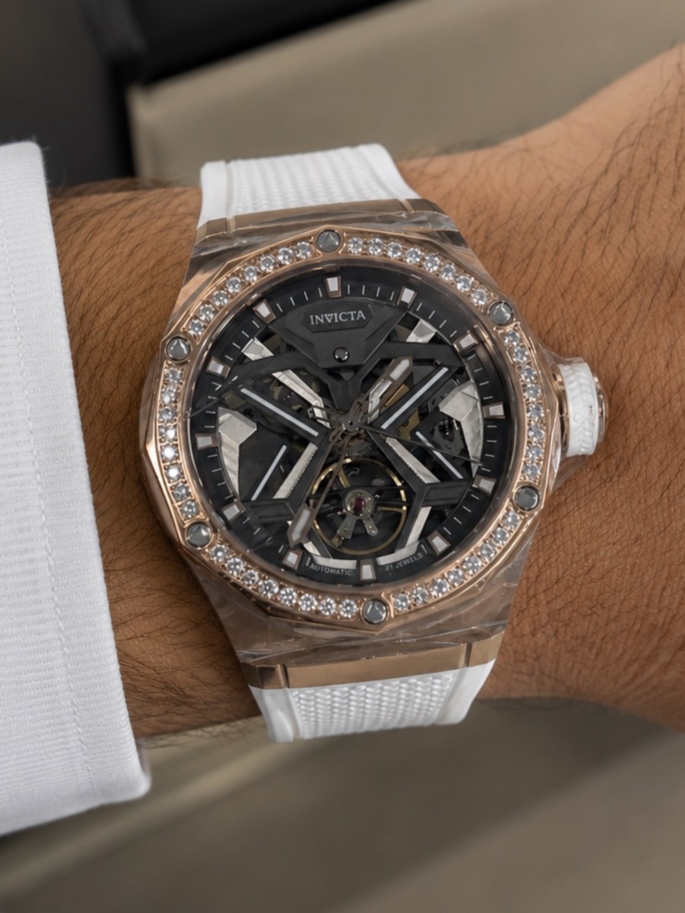 Invicta Rose Gold Skeleton Dial Watch with White Silicone Band and Crystal Bezel